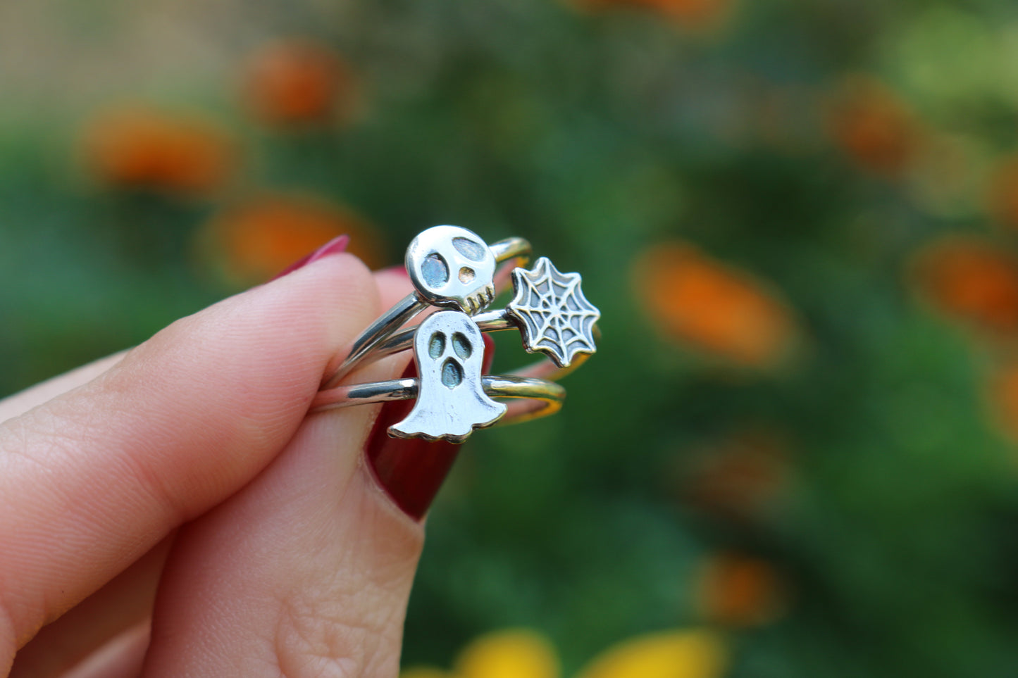 ghost on a silver ring band, tiny skull on a silver ring band, spider web on a silver ring band