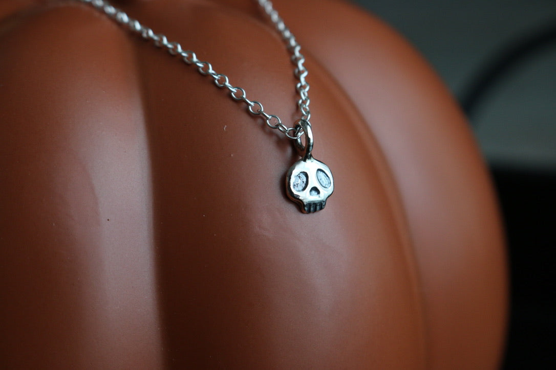 tiny silver skull on a dainty silver chain